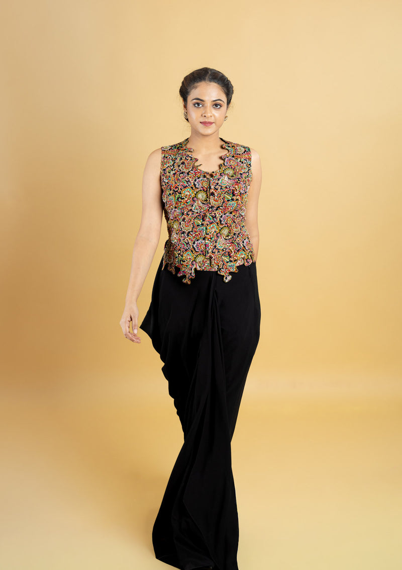 Designer indo western attire, cowl skirt with a corset top, top highlighted with hand embroidery