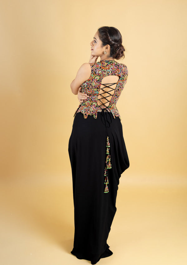 Designer indo western attire, cowl skirt with a corset top, top highlighted with hand embroidery