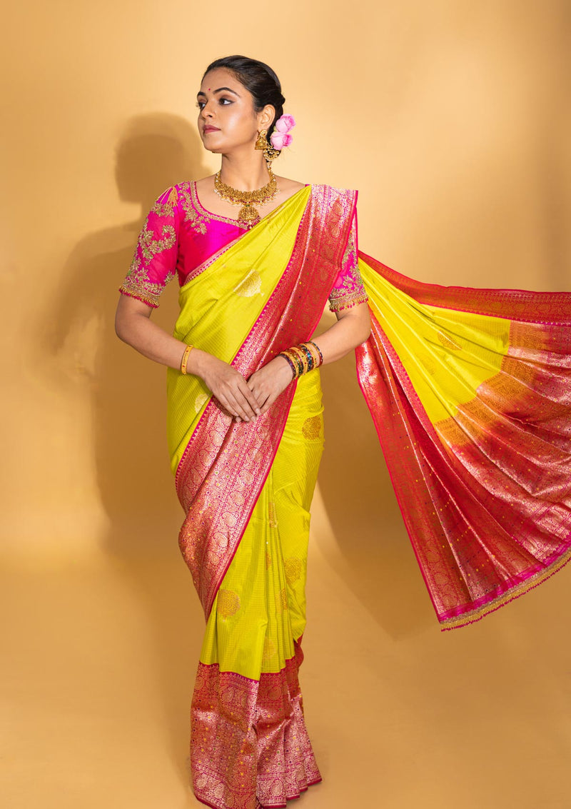 Designer pure banarasi brocade silk saree, with multicolored meena on saree border and on pallu. Saree is clubbed with designer hand embroidered blouse