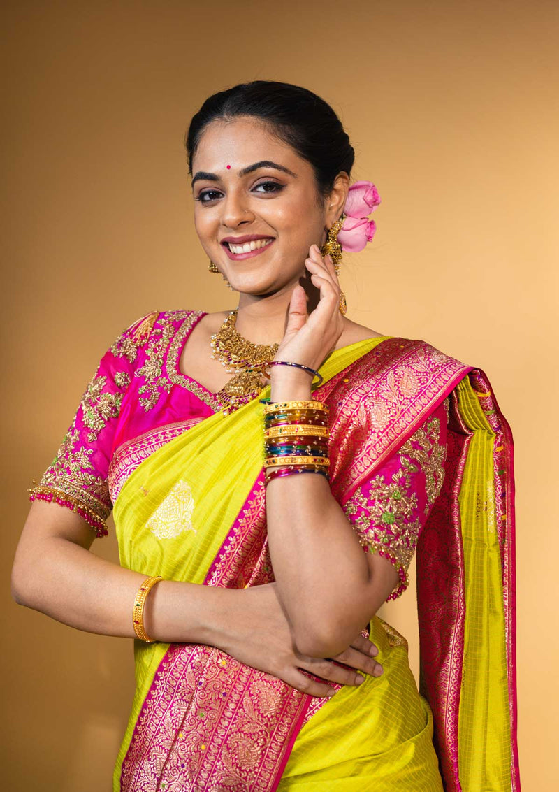 Designer pure banarasi brocade silk saree, with multicolored meena on saree border and on pallu. Saree is clubbed with designer hand embroidered blouse