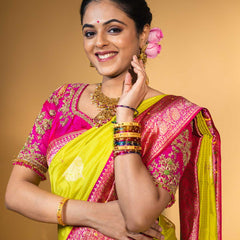 Designer pure banarasi brocade silk saree, with multicolored meena on saree border and on pallu. Saree is clubbed with designer hand embroidered blouse
