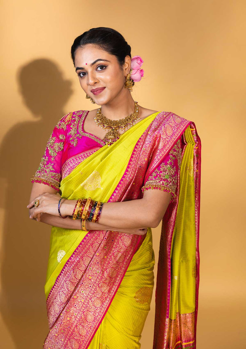 Designer pure banarasi brocade silk saree, with multicolored meena on saree border and on pallu. Saree is clubbed with designer hand embroidered blouse