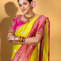 Designer pure banarasi brocade silk saree, with multicolored meena on saree border and on pallu. Saree is clubbed with designer hand embroidered blouse